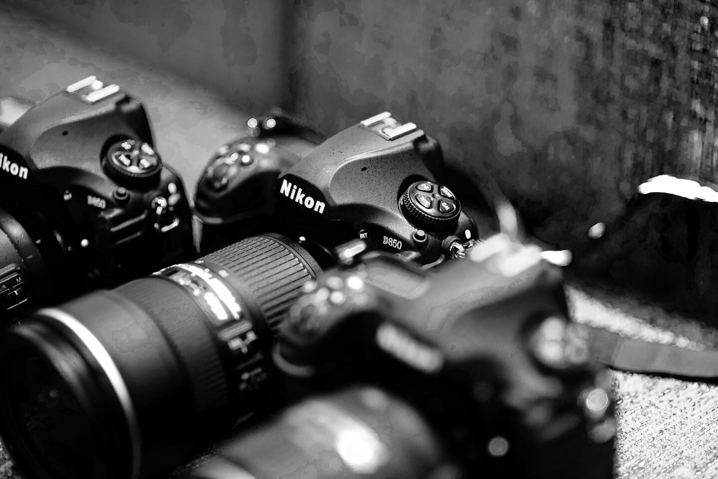 Professional Nikon camera gear ready for event coverage, photographed in natural light to emphasize precision and preparedness.